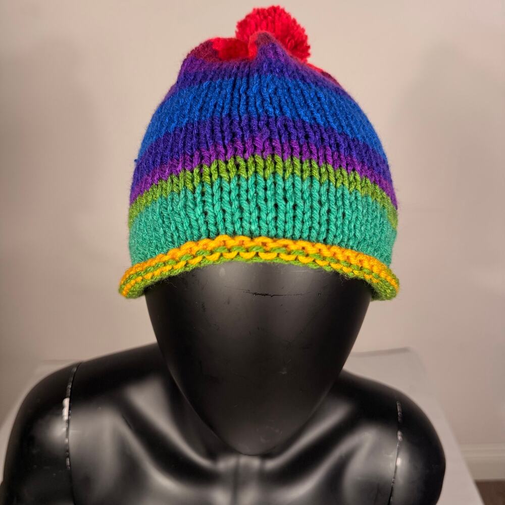 Hand-Knitted Rainbow Striped Beanie with Red Pom-Pom